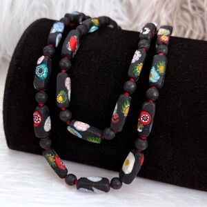 Vintage black weighted painted beaded barrel closure long necklace